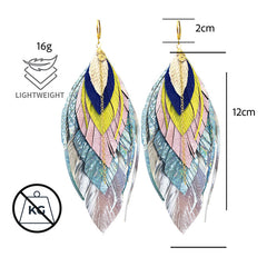 Aretes Largos De Piel Metalizada Vangania Con Baño De Oro Plateado